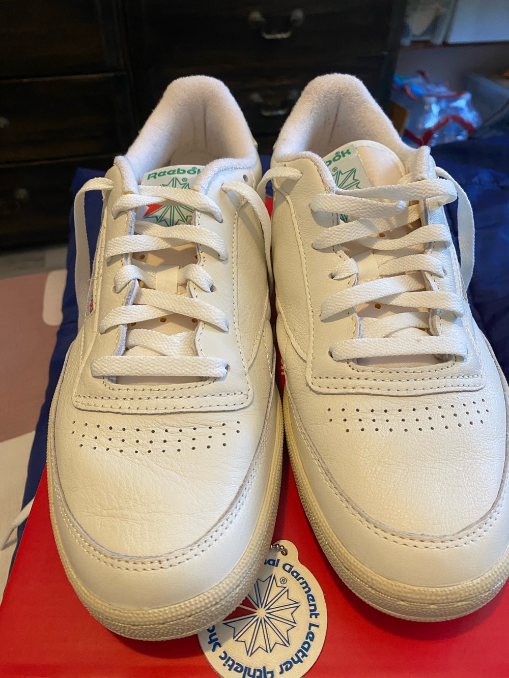 Reebok White Athletic Sneaker with Green Tongue Text